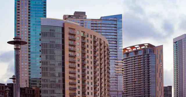 Downtown Austin skyscrapers beneath a cloudy sky.