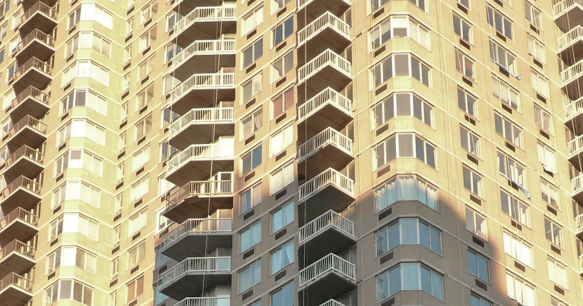 Sunlit balconies on a New York residential high-rise.